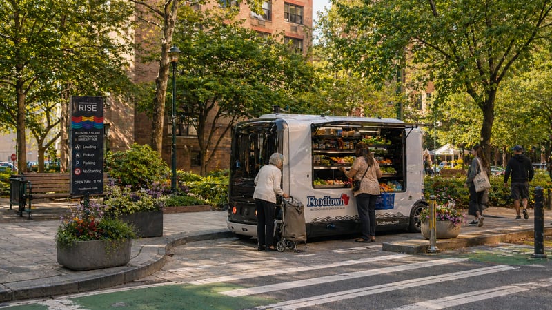 Neighborhood grocery stop where residents can access daily essentials from a low-speed autonomous retail vehicle close to home.